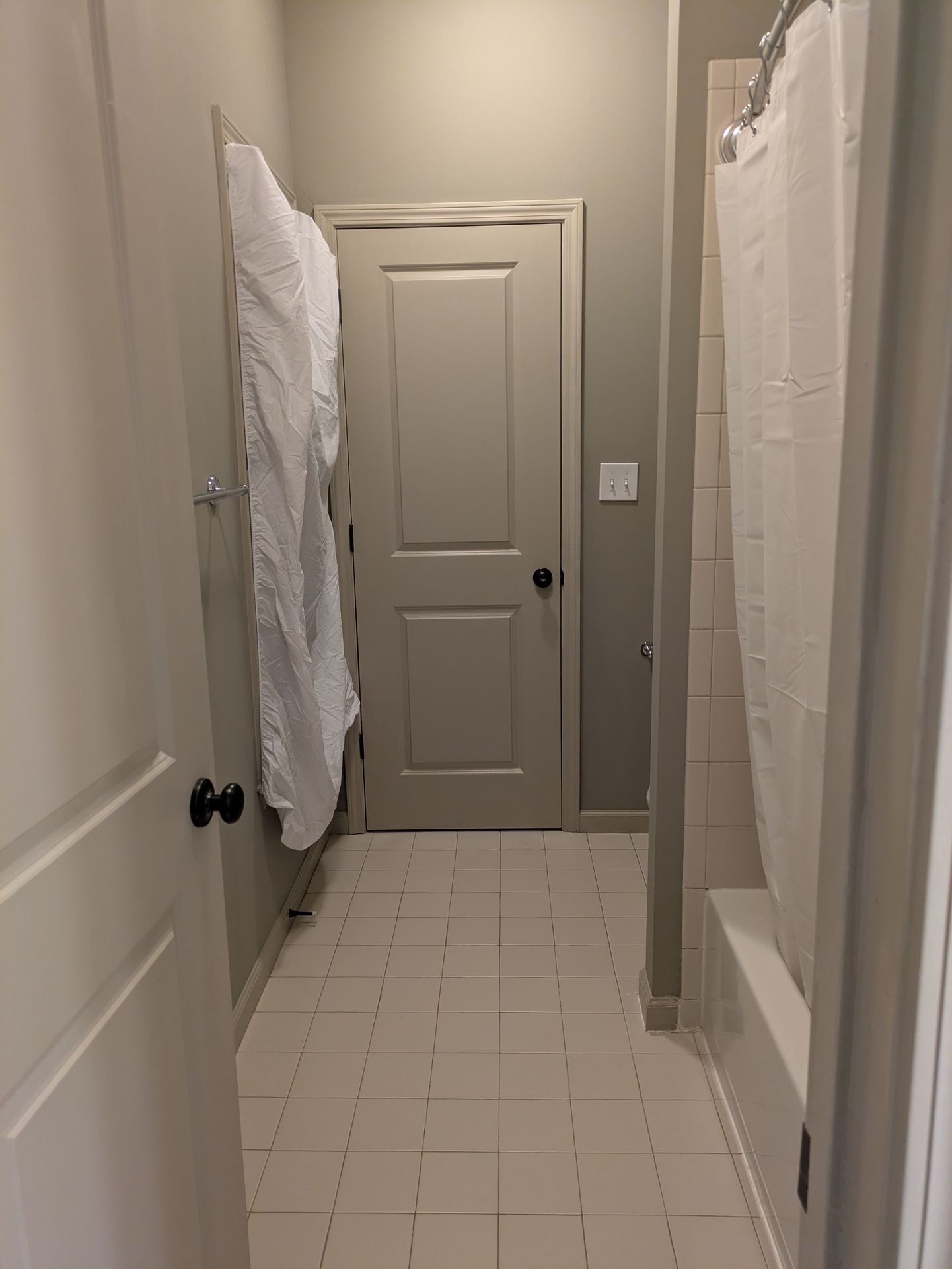 Modern lighting and vanity mirror in a Normaltown bathroom